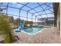 Private screened-in pool with a spa, perfect for recreation and relaxation at 1494 Moon Valley Dr, Davenport, FL 33896