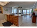 Open kitchen flows to the living area with great ocean view at 5201 S Atlantic Ave # 301A, New Smyrna Beach, FL 32169