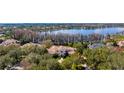 Magnificent home with tile roof, mature landscaping, and access to a beautiful lake at 6126 Kirkstone Ln, Windermere, FL 34786