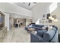 Open-concept living room flows into the kitchen, featuring lots of natural light and comfortable seating at 9192 Bradleigh Dr, Winter Garden, FL 34787