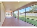 Large screened porch with a ceiling fan overlooking the backyard and providing an outdoor living space at 1515 Angler Ave, Kissimmee, FL 34746