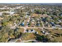 Scenic aerial view of a quiet neighborhood, showcasing tree-lined streets and well-spaced homes at 200 Dr Martin Luther King Jr Se St, Fort Meade, FL 33841