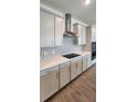 Bright kitchen with stainless steel appliances, sleek cabinets, and stylish backsplash at 4110 Gooseberry Trl, Kissimmee, FL 34746