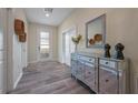 Elegant entryway featuring tiled floors and a mirrored console table at 4532 Target Blvd, Kissimmee, FL 34746