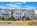 A charming home with a covered front porch, set amidst a beautiful neighborhood and lush landscaping at 896 Tilden Oaks Trl, Winter Garden, FL 34787