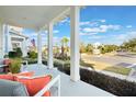 Inviting front porch view with comfortable seating, showcasing the neighborhood ambiance at 896 Tilden Oaks Trl, Winter Garden, FL 34787