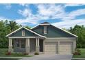 Charming single-story home with blue siding, a two-car garage, and landscaped front yard at 15491 Lebeau Loop, Winter Garden, FL 34787