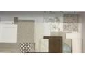 Assorted flooring and cabinet samples displaying material and color options available for kitchen and bathroom upgrades at 15491 Lebeau Loop, Winter Garden, FL 34787