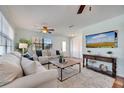 Cozy living room with plush carpet, neutral furniture, and bright natural light, perfect for relaxing at 1775 Druliner Rd, St Cloud, FL 34771