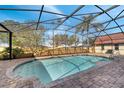 Relaxing screened-in pool area with brick pavers, ideal for outdoor entertaining and enjoyment at 1775 Druliner Rd, St Cloud, FL 34771