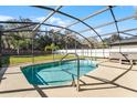 Sparkling pool and spa in screened enclosure offers outdoor enjoyment at 2564 Bullion Loop, Sanford, FL 32771