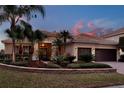 Charming single-story home with well-maintained landscaping, a three-car garage, and a tile roof at 3571 Somerset Cir, Kissimmee, FL 34746