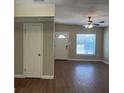 Inviting living room features hardwood floors, a ceiling fan, and natural light at 905 Governors Ave, Orlando, FL 32808