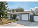 Well-maintained single-story home showing the driveway and garage at 1004 Sunwood Ln, Orlando, FL 32807