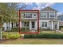 Charming two-story townhome with well-manicured lawn and inviting front porch at 10358 Spring Arbor Ln, Winter Garden, FL 34787