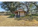 A small home with a front porch and a ramp to the front door at 1213 Cr 652, Bushnell, FL 33513