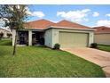 Single Gathering home with a two-car garage and well-kept lawn at 13812 Cepheus Dr, Orlando, FL 32828