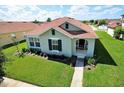 Inviting one-story home boasting lush green lawn and covered front porch at 13812 Cepheus Dr, Orlando, FL 32828