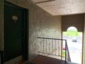 Hallway shot showcasing the unit door and view of the parking lot at 285 Wymore Rd # 204, Altamonte Springs, FL 32714