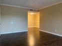 Bright living room with laminate wood floors and views to another room at 285 Wymore Rd # 204, Altamonte Springs, FL 32714