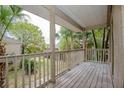 Private balcony overlooking mature trees offers a serene outdoor retreat at 385 Wymore Rd # 200, Altamonte Springs, FL 32714