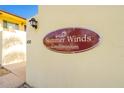 Summer Winds Condominium sign on the side of the building with building number 400 and a light fixture at 400 Oakridge Blvd # 5, Daytona Beach, FL 32118