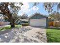 A charming single-story home with a well-maintained yard and a driveway leading to an attached two-car garage at 4515 Sea Biscut Ct, Orlando, FL 32818