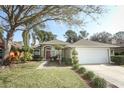 Charming single-story home with lush front yard and attached two-car garage at 500 Pickfair Ter, Lake Mary, FL 32746