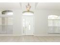 Bright foyer with tiled flooring, chandelier, and natural light at 500 Pickfair Ter, Lake Mary, FL 32746