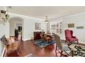 Elegant dining room featuring hardwood floors and stylish furniture at 8044 Saint James Way, Mount Dora, FL 32757