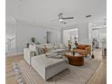 Bright living room featuring hardwood floors, plush sectional sofa, and contemporary decor at 945 N Fern Creek Ave, Orlando, FL 32803