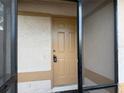 Front entry of home featuring an adjacent screened in porch at 1002 Stucki Ter, Winter Garden, FL 34787