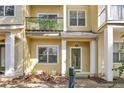 Charming home featuring a balcony with leafy privacy screens and a welcoming facade at 11 W Harding St # D, Orlando, FL 32806