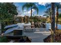 Wooden dock featuring a picnic table and kayak storage racks with water views at 1100 S Lake Sybelia Dr, Maitland, FL 32751