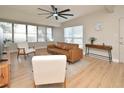 Cozy living room featuring neutral walls, hardwood floors, and a large window for ample light at 117 Shannon Dr, Sanford, FL 32773