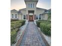 Elegant home exterior showcasing manicured landscaping and an inviting entryway at 12625 Sweet Hill Rd, Polk City, FL 33868