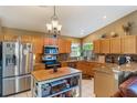 Well-lit kitchen with stainless steel appliances and granite countertops at 13209 Wild Duck Ct, Orlando, FL 32828