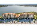 Stunning aerial view of condo community with ample parking and lake views at 16300 County Road 455 # 712, Montverde, FL 34756