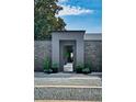 Stunning modern entryway featuring a stone wall, clean lines, and minimalist design at 2010 Hoffner Ave, Belle Isle, FL 32809