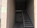 Exterior staircase leading to upper level unit featuring painted wall finish at 335 Wymore Rd # 201, Altamonte Springs, FL 32714