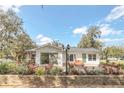 Back exterior with brick patio, outdoor seating, pergola, and scenic views at 632 Tranquil Oaks Ln, Oviedo, FL 32765