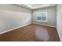 An empty bedroom with tiled floors, crown molding, light colored walls and natural light at 1038 Commuter Dr, Deltona, FL 32738