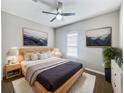 Beautiful bedroom featuring a ceiling fan, a light wood bed frame, and tasteful art at 1038 Commuter Dr, Deltona, FL 32738