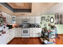 Functional kitchen featuring white cabinets and laminate countertops, ready for a personal design touch at 1221 Forest Cir, Altamonte Springs, FL 32714