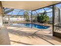 Screened-in pool with a covered patio, providing a perfect spot for outdoor relaxation and entertainment at 12972 Broakfield Cir, Orlando, FL 32837