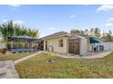 Expansive backyard with screened pool enclosure and convenient storage shed at 12991 Sw 72Nd Terrace Rd, Ocala, FL 34473