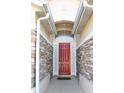 Inviting front entryway featuring a decorative door and stone wall accents at 1746 Golfview Drive, Kissimmee, FL 34746