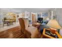 Comfortable living room featuring hardwood floors and traditional furnishings at 212 Glenn St, Leesburg, FL 34748