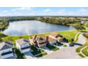 Aerial view of house near lake with scenic greenery at 259 Southbridge Cir, Kissimmee, FL 34744