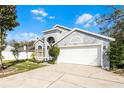 Inviting single story home with a two car garage and long driveway at 2957 Birmingham Blvd, Orlando, FL 32829